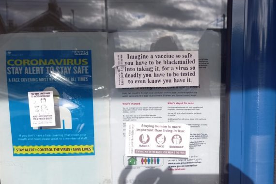 GP practice door plastered with anti-vaccine messages ahead of clinic